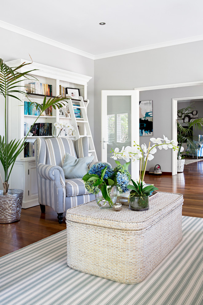 This is an example of a beach style formal enclosed living room in Perth with grey walls and dark hardwood floors.