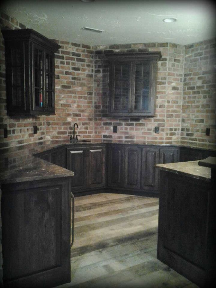 Photo of a mid-sized country wine cellar in Cleveland with dark hardwood floors.