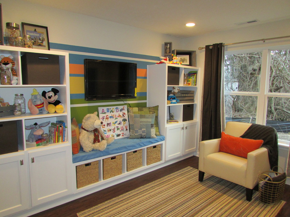 Inspiration for a mid-sized gender-neutral kids' playroom for kids 4-10 years old in Indianapolis with beige walls, vinyl floors and brown floor.
