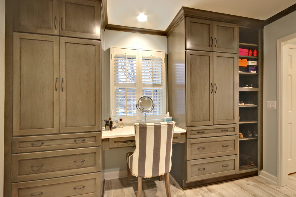 Inspiration for an expansive traditional women's dressing room in Grand Rapids with recessed-panel cabinets, grey cabinets, ceramic floors and beige floor.