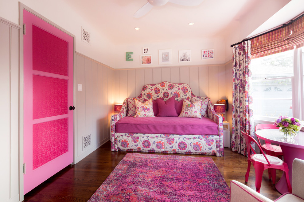 Inspiration for a small traditional kids' bedroom for kids 4-10 years old and girls in Los Angeles with grey walls and dark hardwood floors.