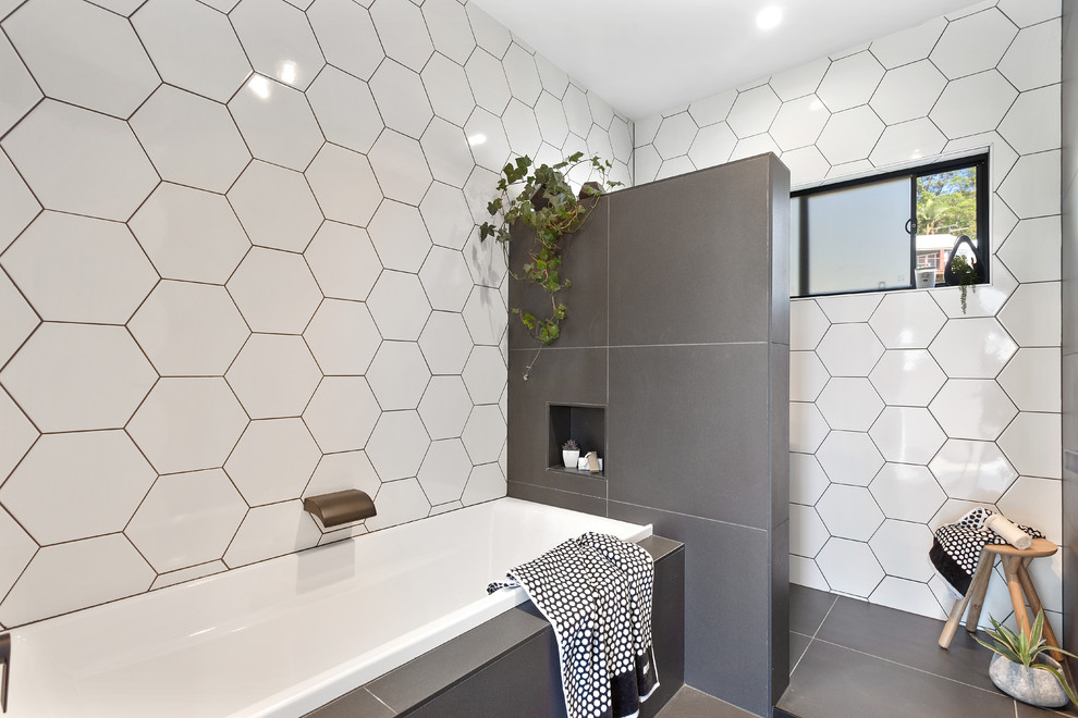 Inspiration for a contemporary bathroom in Sunshine Coast with a drop-in tub.