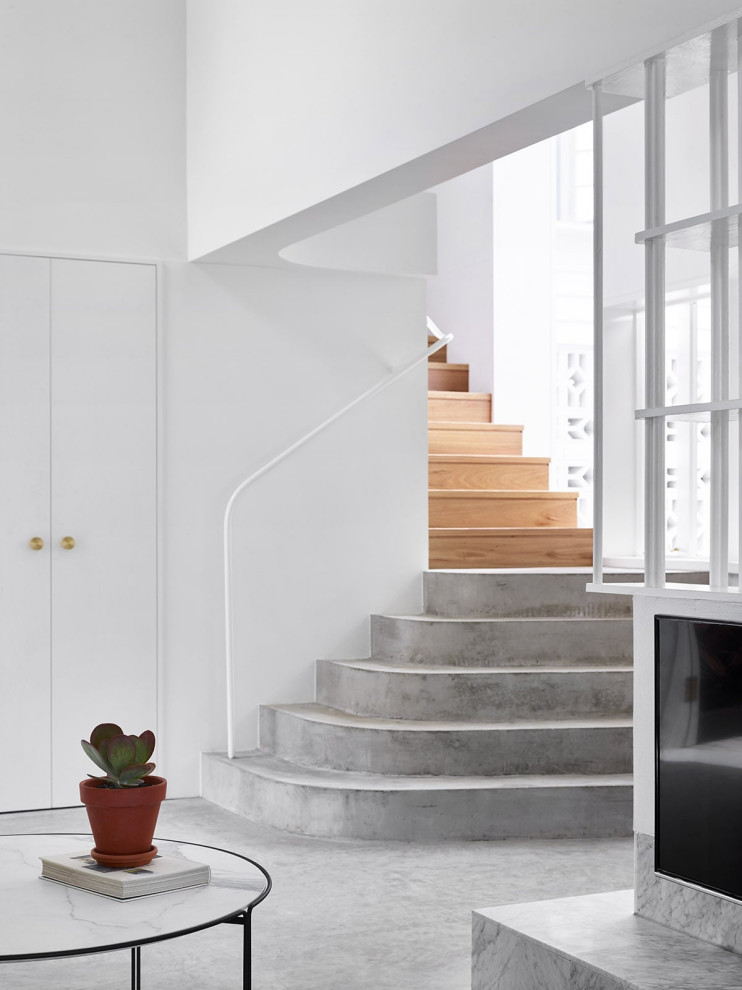 This is an example of a beach style concrete staircase in Brisbane with concrete risers.