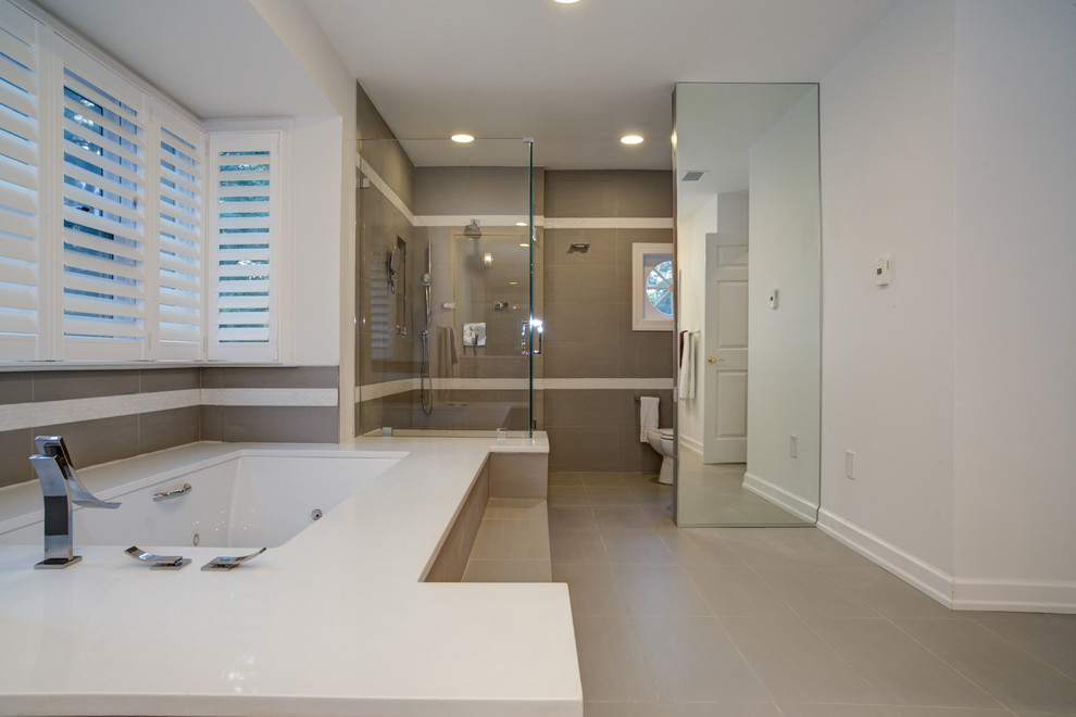 Inspiration for a large contemporary master bathroom in DC Metro with an undermount sink, shaker cabinets, grey cabinets, engineered quartz benchtops, an undermount tub, an open shower, a bidet, gray tile, porcelain tile, white walls and porcelain floors.