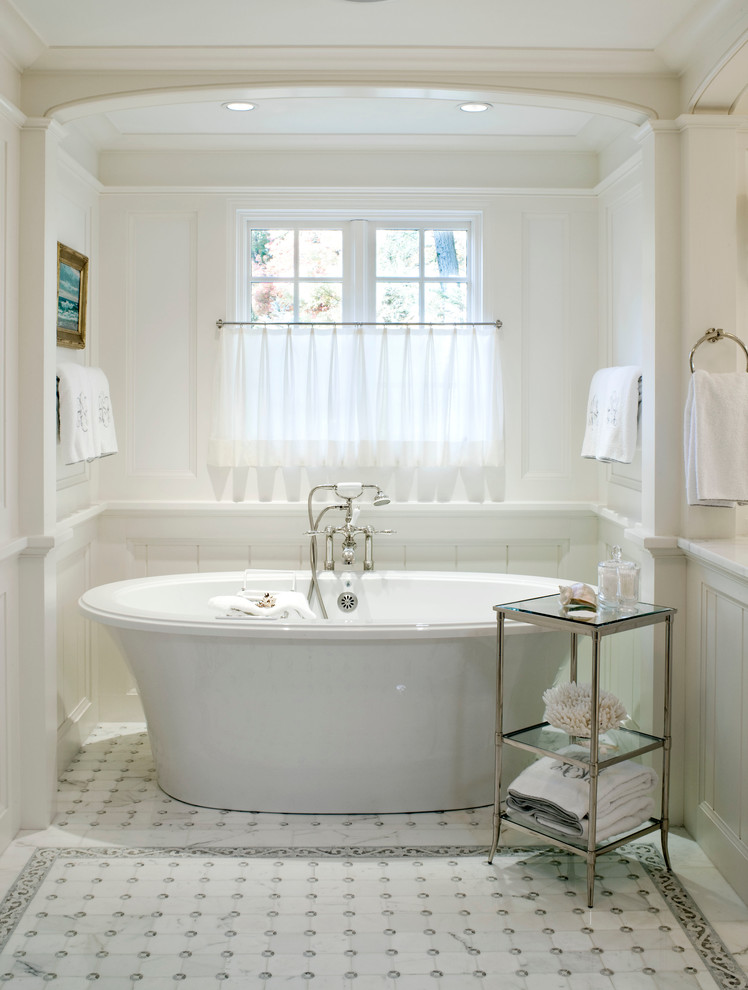 Photo of a traditional master bathroom in Boston with a freestanding tub, marble benchtops, white tile, mosaic tile, white walls and marble floors.