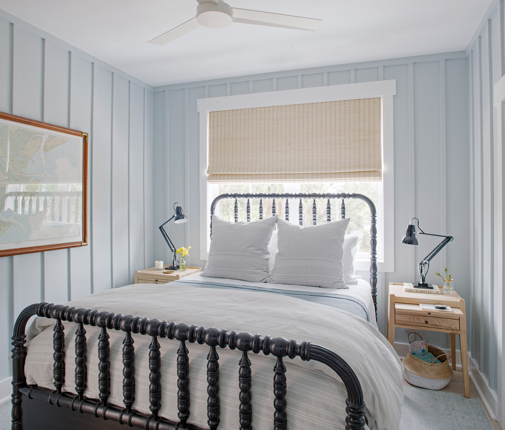 Inspiration for a small coastal guest light wood floor bedroom remodel with blue walls and no fireplace