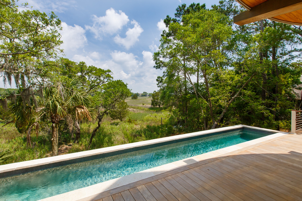 This is an example of a mid-sized transitional aboveground pool in Charleston.