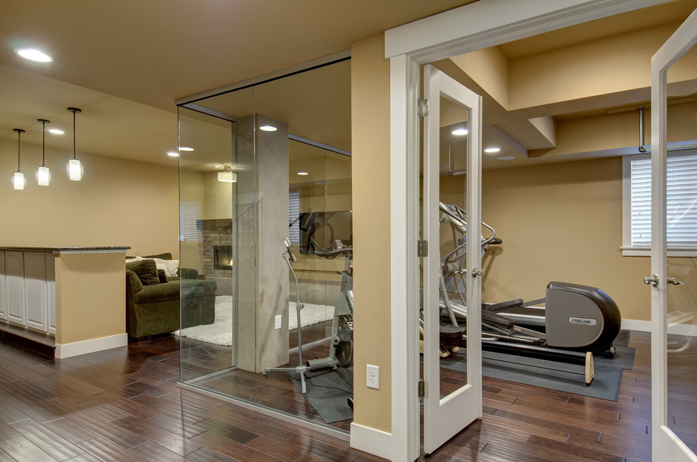 Mid-sized transitional multipurpose gym in Denver with beige walls, dark hardwood floors and brown floor.