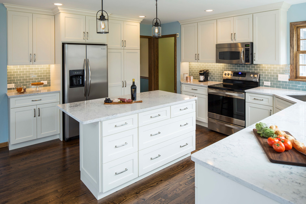 Inspiration for a transitional eat-in kitchen in Minneapolis with recessed-panel cabinets, white cabinets, quartz benchtops, blue splashback, subway tile splashback, stainless steel appliances, medium hardwood floors and with island.