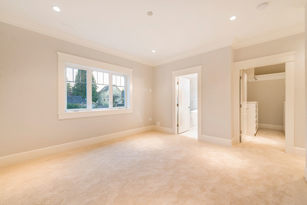 Large transitional master bedroom in Vancouver with grey walls, carpet and no fireplace.