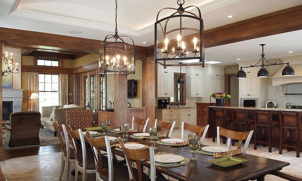Inspiration for a mid-sized country open plan dining in Houston with beige walls, travertine floors and no fireplace.