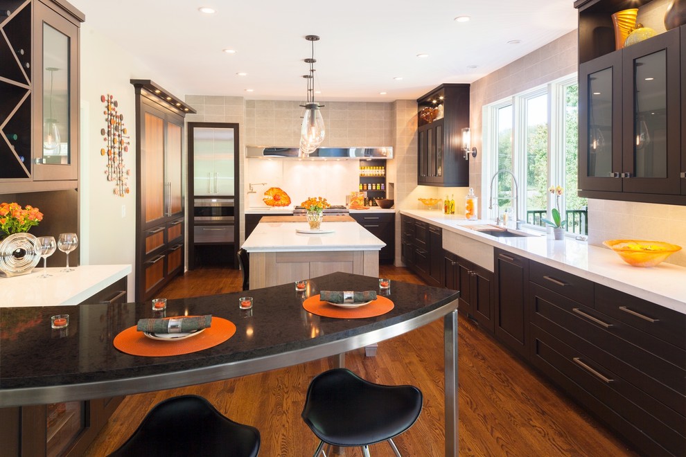 This is an example of a contemporary kitchen in Denver with quartz benchtops.