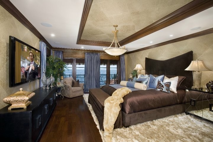Inspiration for a large contemporary master bedroom in Los Angeles with beige walls, dark hardwood floors and no fireplace.