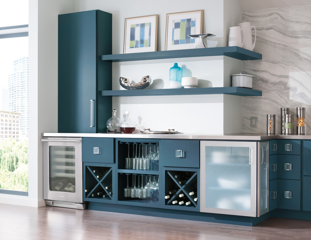 Design ideas for a large contemporary wet bar in Boston with flat-panel cabinets, blue cabinets, concrete benchtops, medium hardwood floors, brown floor and grey benchtop.