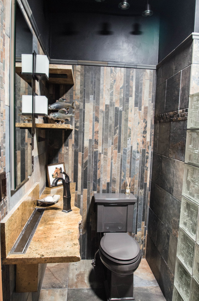 Design ideas for a mid-sized country bathroom in Other with a curbless shower, a two-piece toilet, multi-coloured tile, slate, black walls, slate floors, a wall-mount sink, multi-coloured floor, an open shower and orange benchtops.