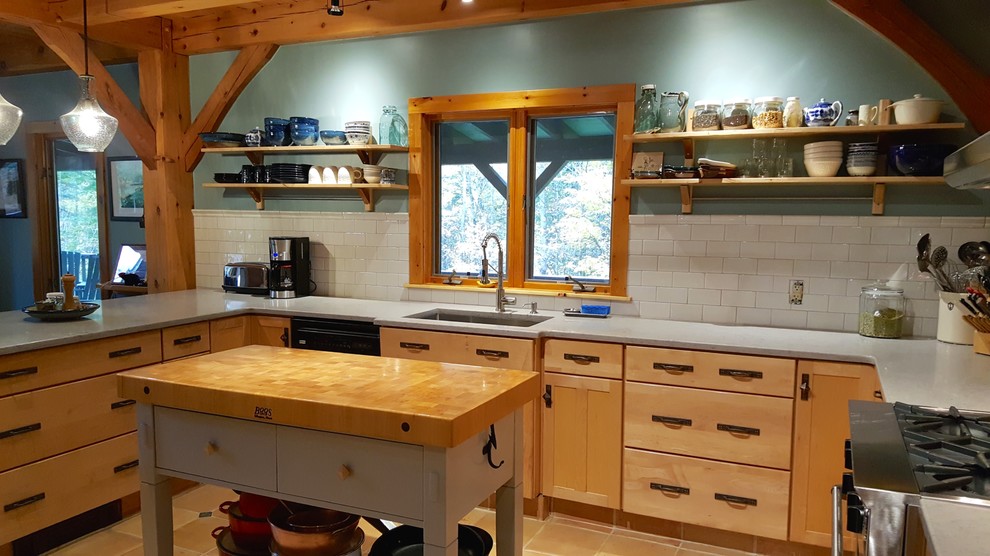 Mid-sized mountain style u-shaped terra-cotta tile and beige floor eat-in kitchen photo with an undermount sink, shaker cabinets, light wood cabinets, quartz countertops, white backsplash, subway tile backsplash, stainless steel appliances, a peninsula and gray countertops