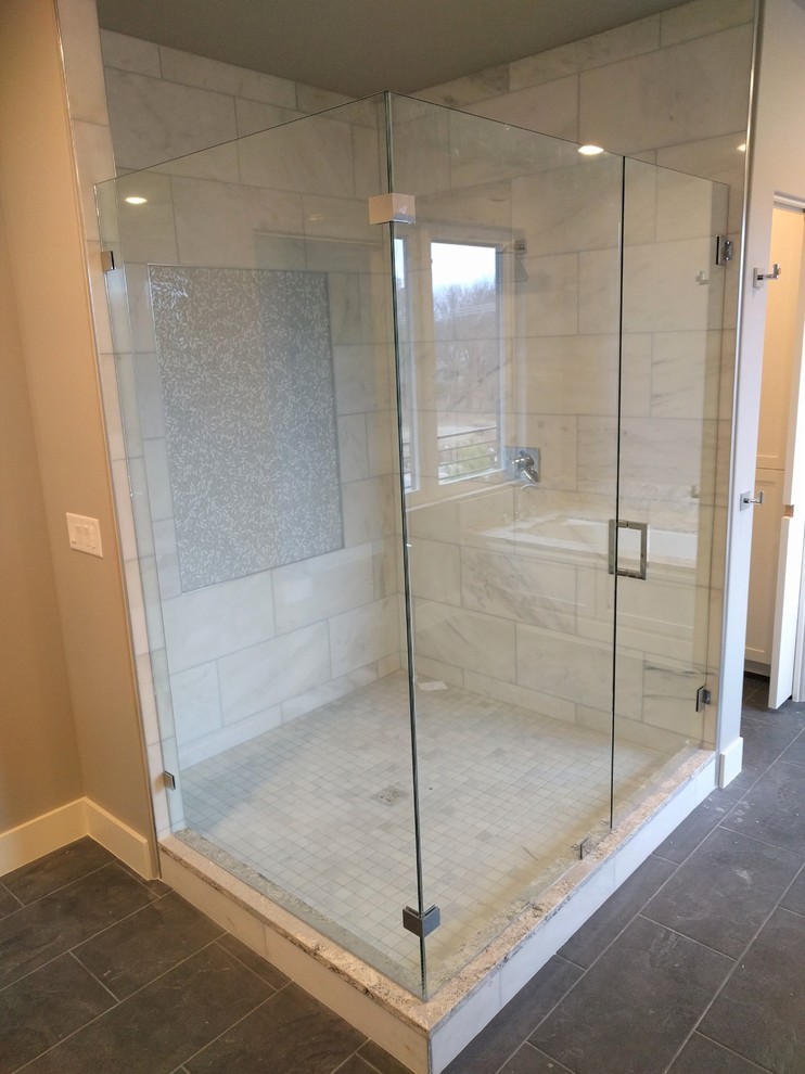 Transitional bathroom photo with a hinged shower door