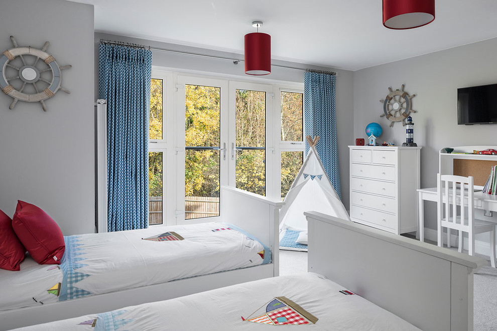 Inspiration for a mid-sized contemporary gender-neutral kids' bedroom for kids 4-10 years old in Berkshire with grey walls, carpet and beige floor.