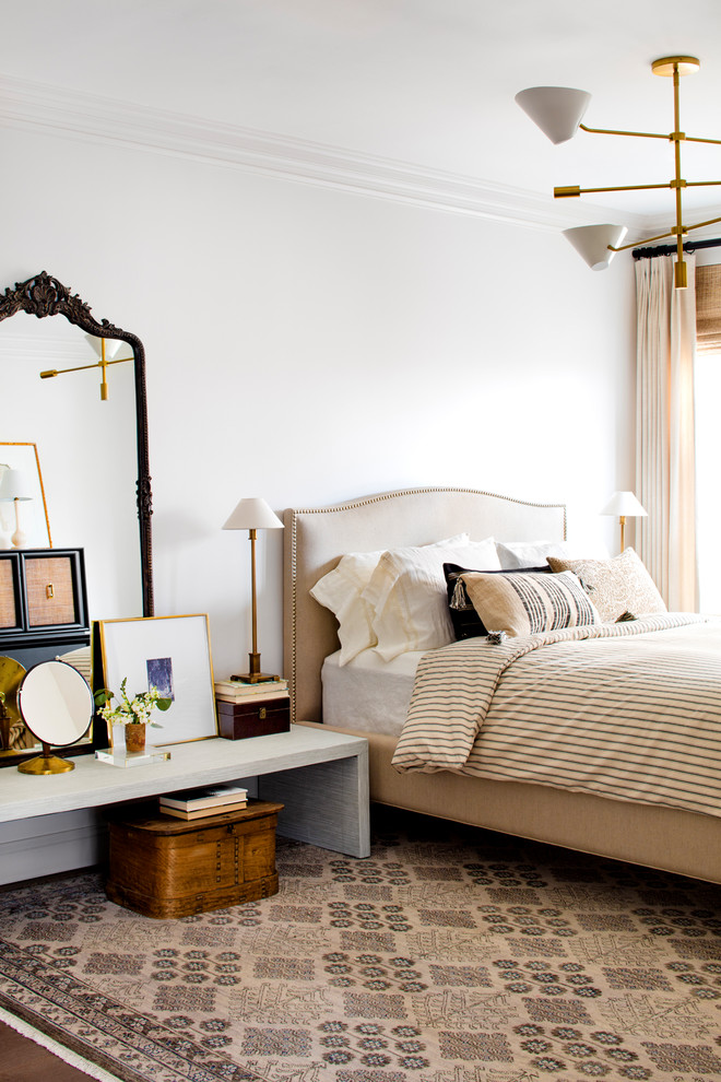 Inspiration for a mid-sized eclectic master bedroom in Austin with grey walls, medium hardwood floors and brown floor.