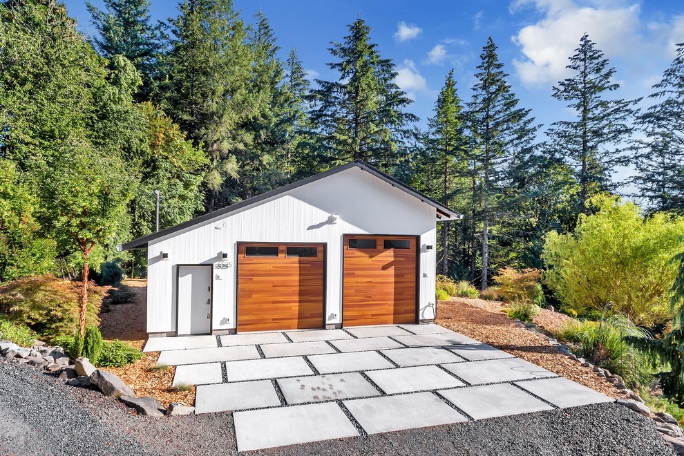 This is an example of a large modern detached four-car garage in Portland.