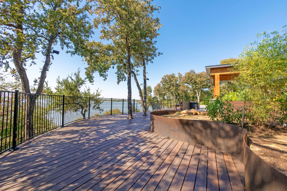 Inspiration for a modern backyard ground level deck remodel
