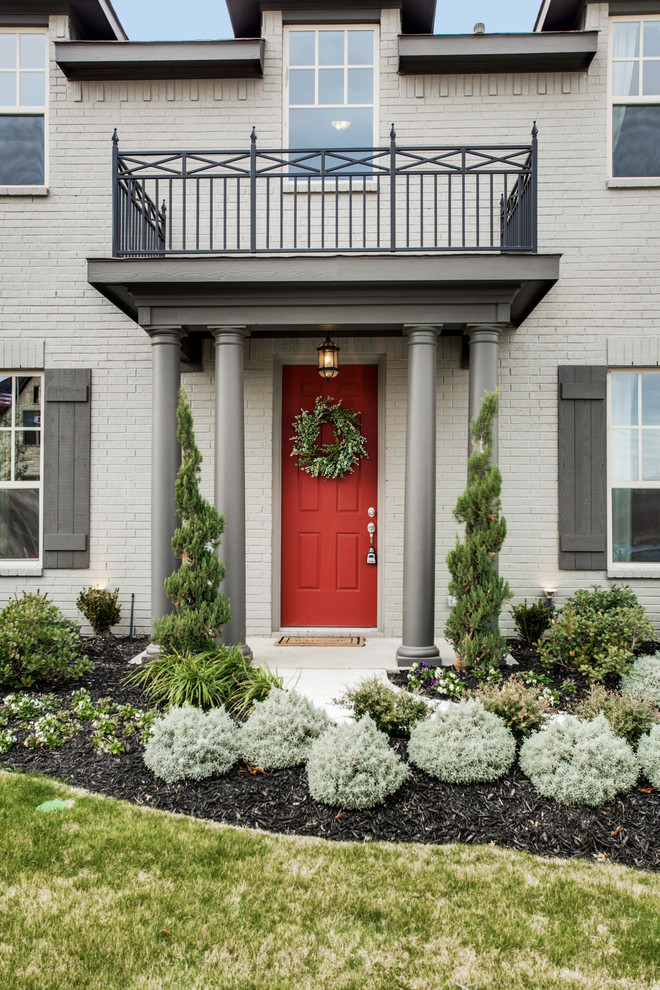 Inspiration for a traditional front door in Dallas with a single front door and a red front door.