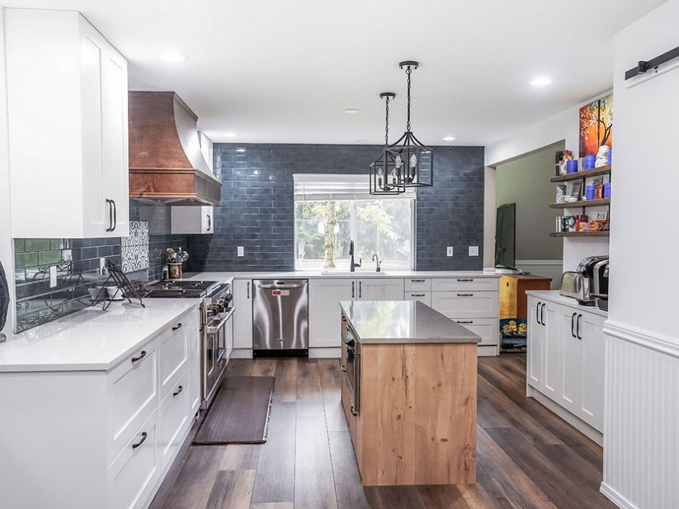 Mid-sized transitional l-shaped separate kitchen in Seattle with an undermount sink, white cabinets, stainless steel appliances, dark hardwood floors, with island, brown floor, white benchtop, coffered, shaker cabinets, quartzite benchtops, blue splashback and porcelain splashback.