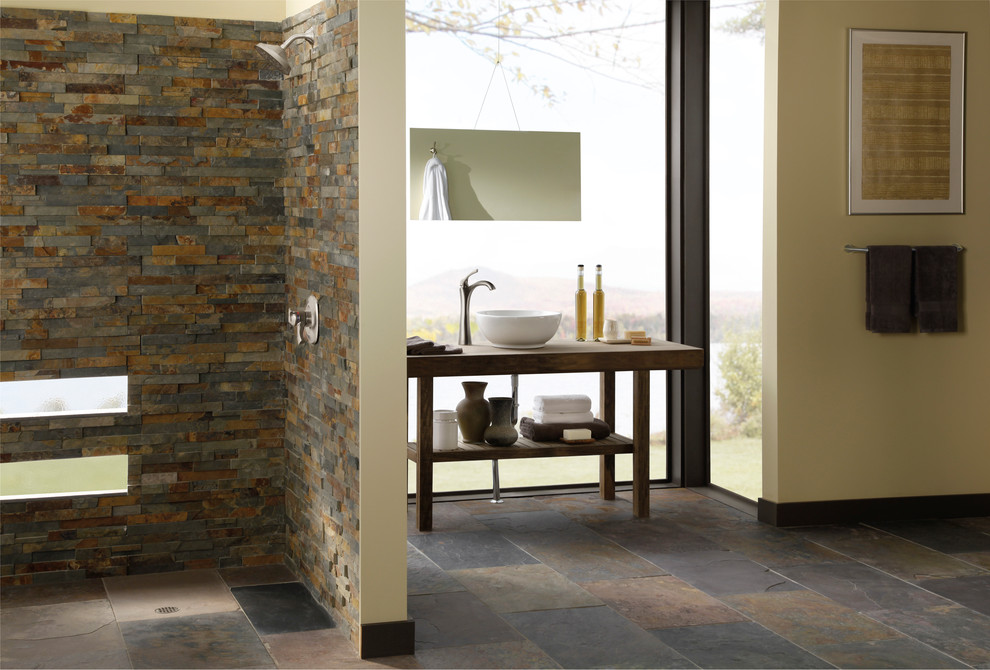 Home design - rustic master brown tile slate floor home design idea in Indianapolis with a vessel sink, open cabinets, medium tone wood cabinets, wood countertops and yellow walls