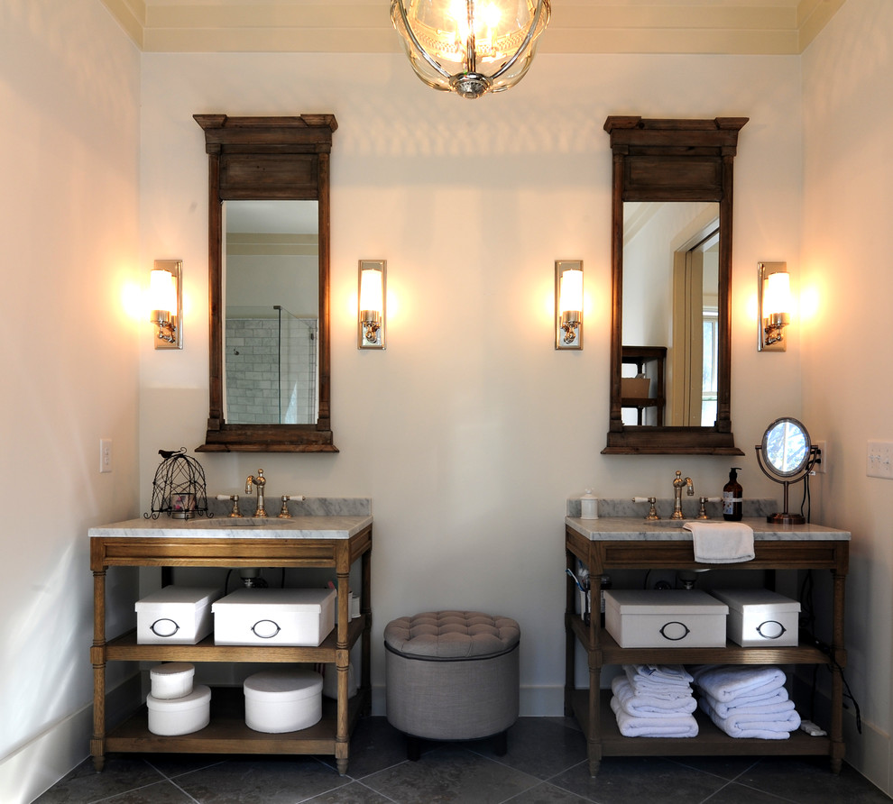 Arts and crafts master bathroom in San Francisco with an undermount sink, shaker cabinets, beige cabinets, marble benchtops, a freestanding tub, a corner shower, a two-piece toilet, gray tile, porcelain tile, grey walls and porcelain floors.