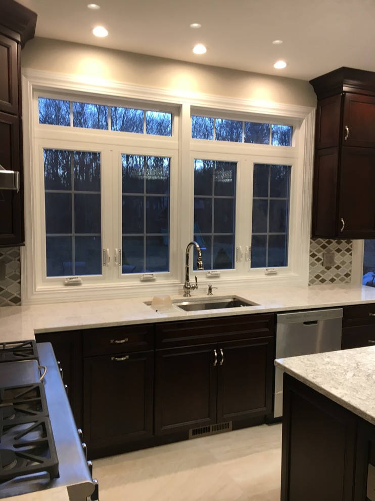 Kitchen - mid-sized transitional l-shaped ceramic tile and beige floor kitchen idea in New York with an undermount sink, shaker cabinets, dark wood cabinets, quartzite countertops, multicolored backsplash, porcelain backsplash and an island