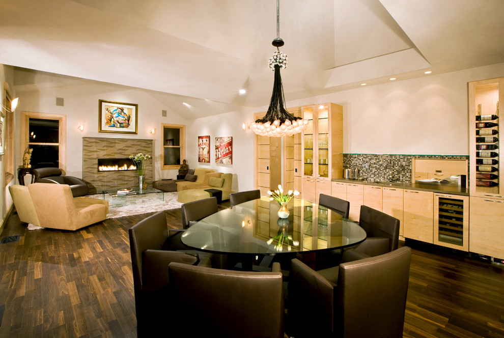 Inspiration for a transitional dark wood floor great room remodel in Denver with beige walls and a standard fireplace