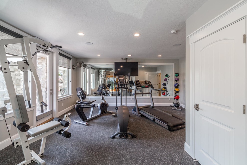 Inspiration for a large transitional multipurpose gym in Salt Lake City with grey walls, vinyl floors and grey floor.