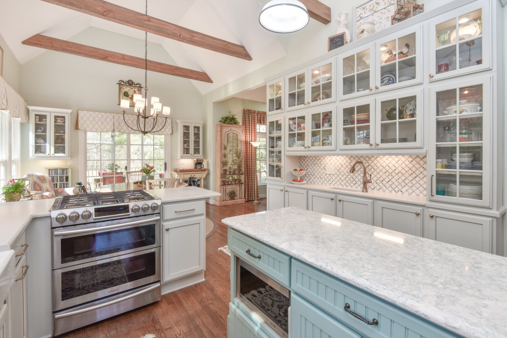 Large transitional u-shaped kitchen photo in DC Metro with a farmhouse sink, recessed-panel cabinets, quartz countertops, stainless steel appliances and an island
