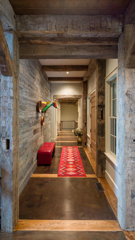 This is an example of a country hallway in Atlanta with concrete floors.