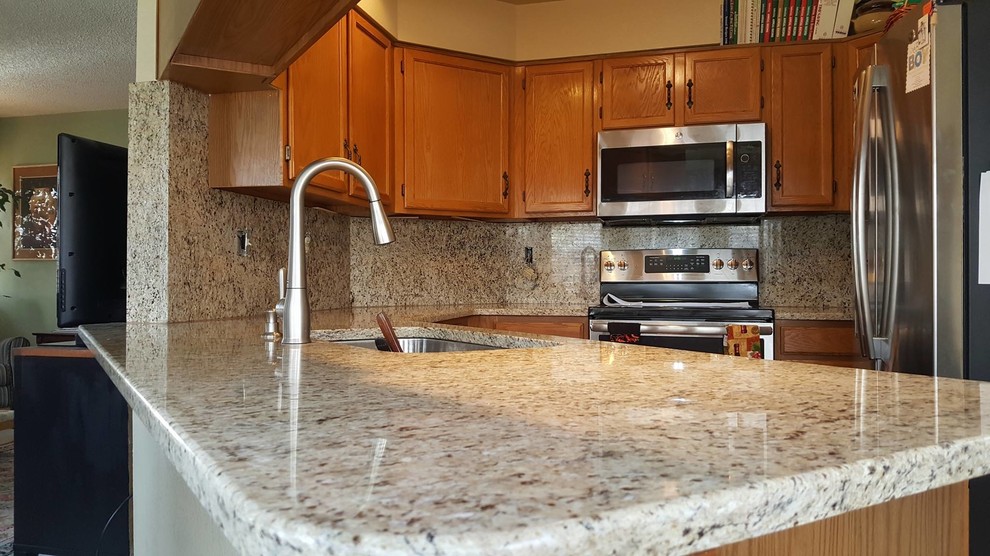 Example of a transitional kitchen design in Denver