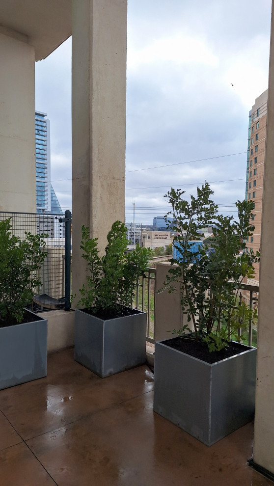 Medium sized mediterranean apartment balcony in Austin.