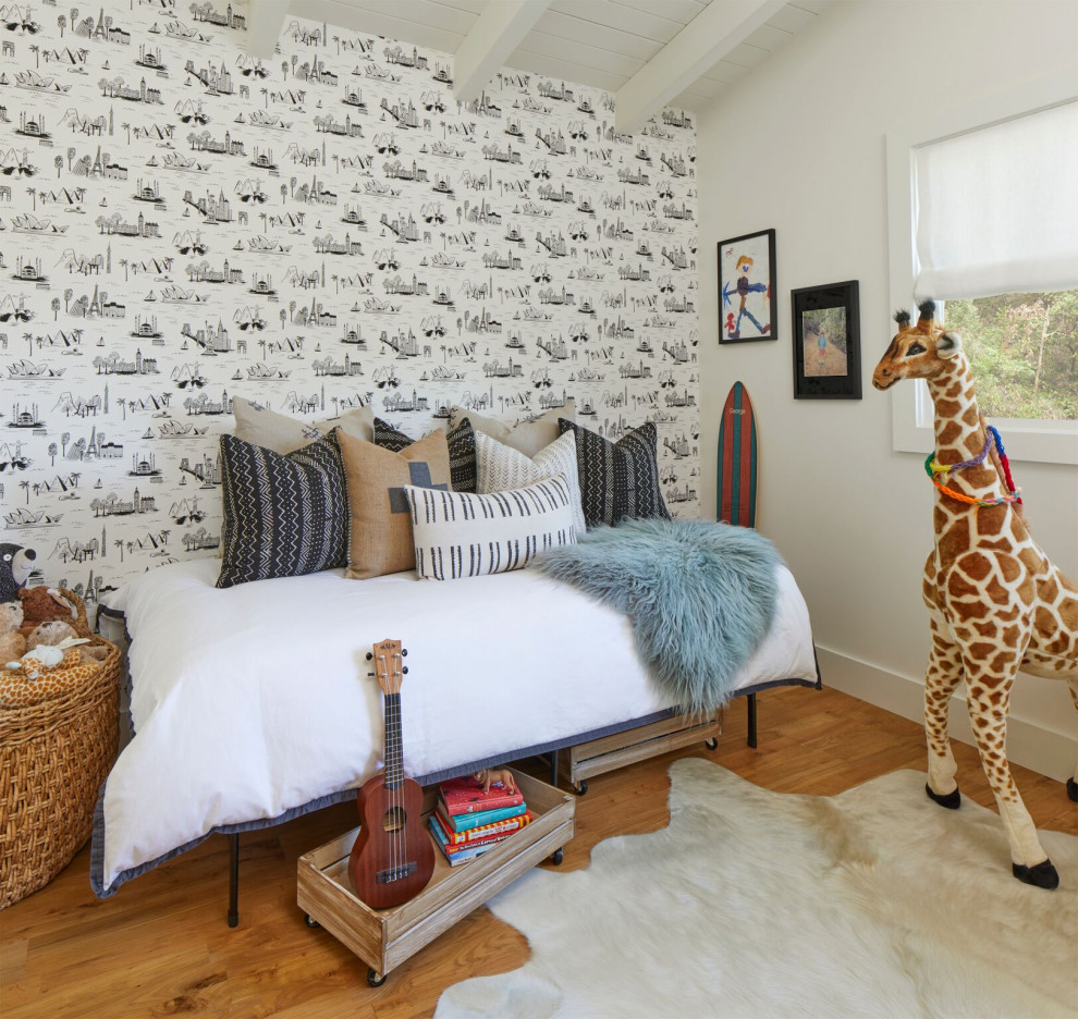 Design ideas for a small transitional kids' bedroom for kids 4-10 years old and boys in San Francisco with white walls, medium hardwood floors, brown floor and wallpaper.
