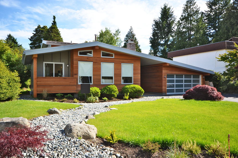 This is an example of a contemporary exterior in Vancouver with wood siding.