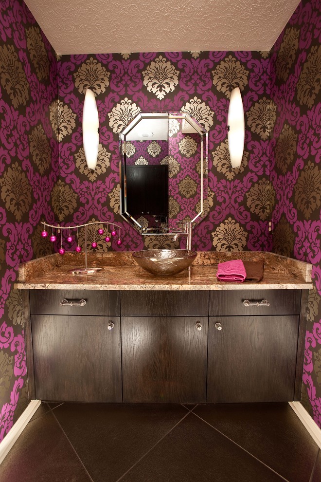 This is an example of an eclectic powder room in Omaha with granite benchtops, a vessel sink and brown benchtops.