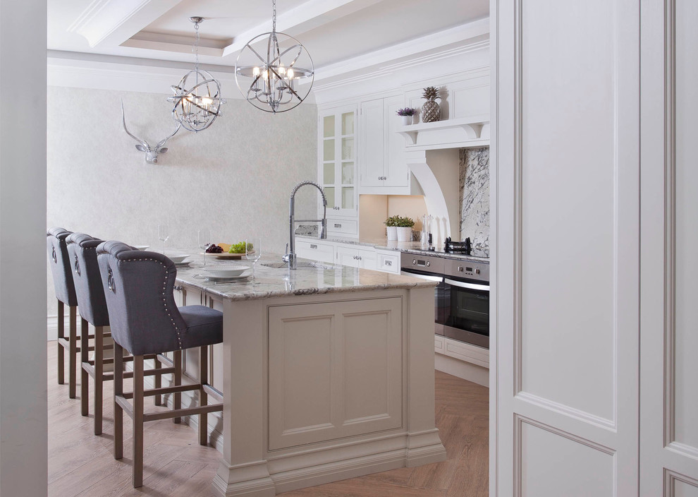 Inspiration for a large traditional l-shaped separate kitchen in Dublin with an undermount sink, louvered cabinets, beige cabinets, granite benchtops, multi-coloured splashback, stone slab splashback, stainless steel appliances, porcelain floors and with island.