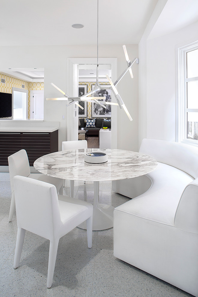 Photo of a large contemporary dining room in New York with white walls and ceramic floors.