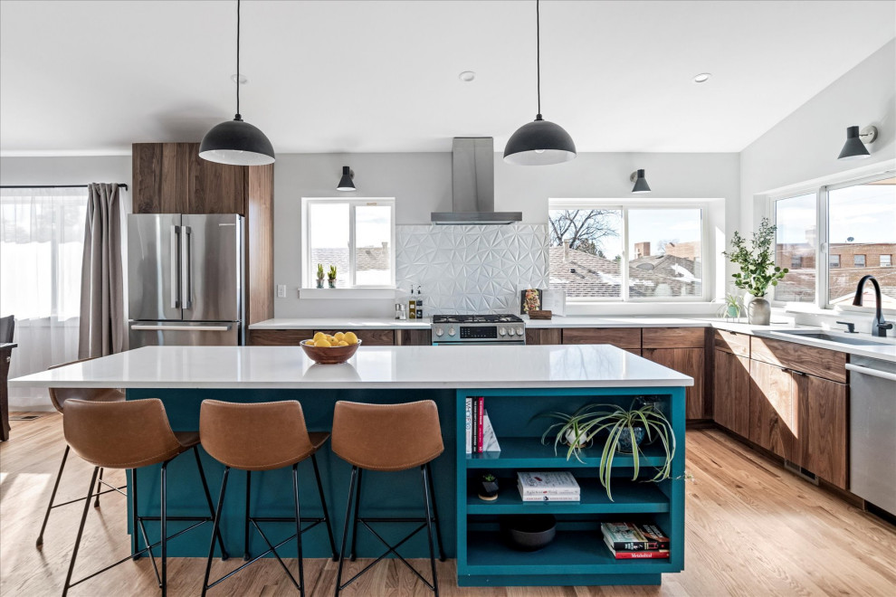 Inspiration for a medium sized midcentury l-shaped kitchen/diner in Denver with a submerged sink, flat-panel cabinets, turquoise cabinets, granite worktops, white splashback, porcelain splashback, stainless steel appliances, medium hardwood flooring, an island, brown floors, white worktops and a vaulted ceiling.