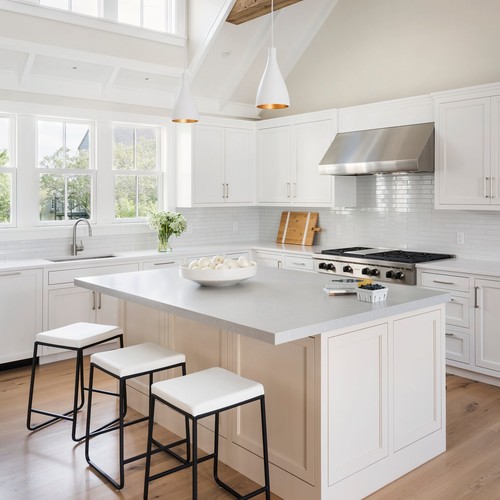 All White Kitchen with shaker-style cabinets, quartz countertop island, stainless steel appliances, and pendant lighting under vaulted ceilings — bright and timeless design for Canadian homes