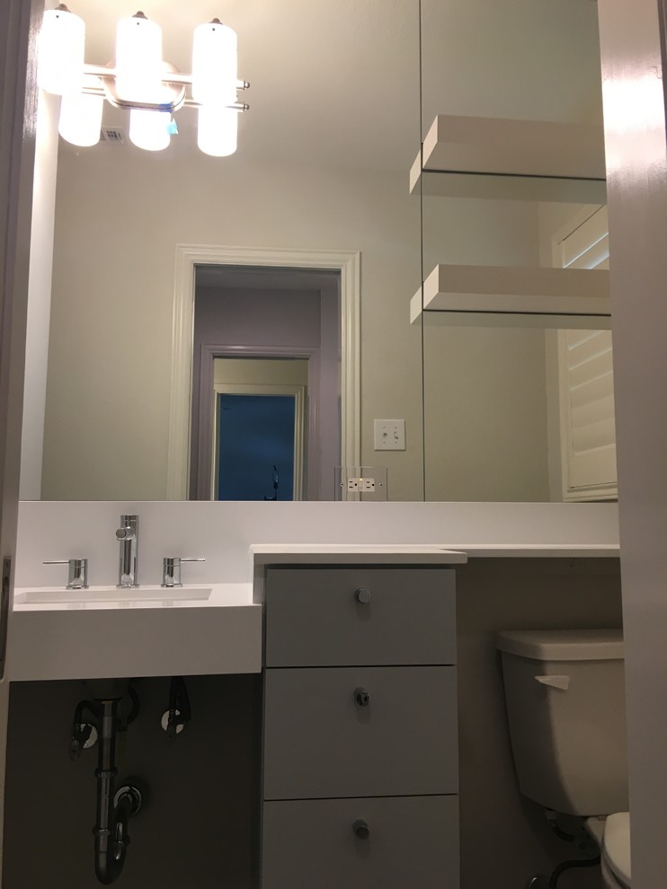 Home design - transitional porcelain tile home design idea in Dallas with medium tone wood cabinets, an undermount sink and quartz countertops
