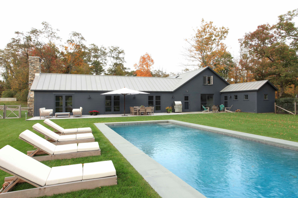Design ideas for a farmhouse rectangular lengths swimming pool in New York.