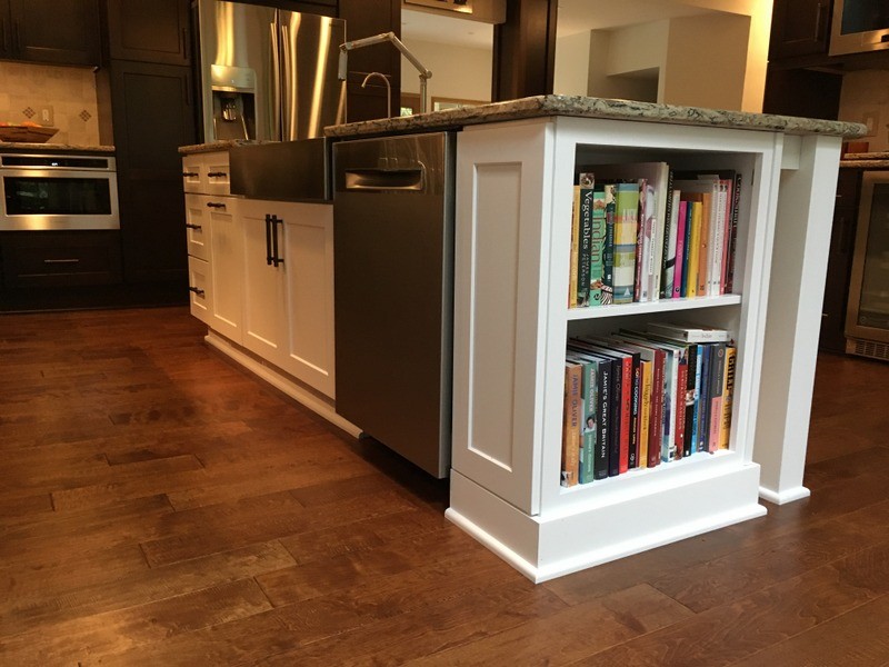Large transitional u-shaped porcelain tile home design photo in Detroit with a farmhouse sink, shaker cabinets, white cabinets, quartz countertops, beige backsplash, stone tile backsplash, stainless steel appliances and an island