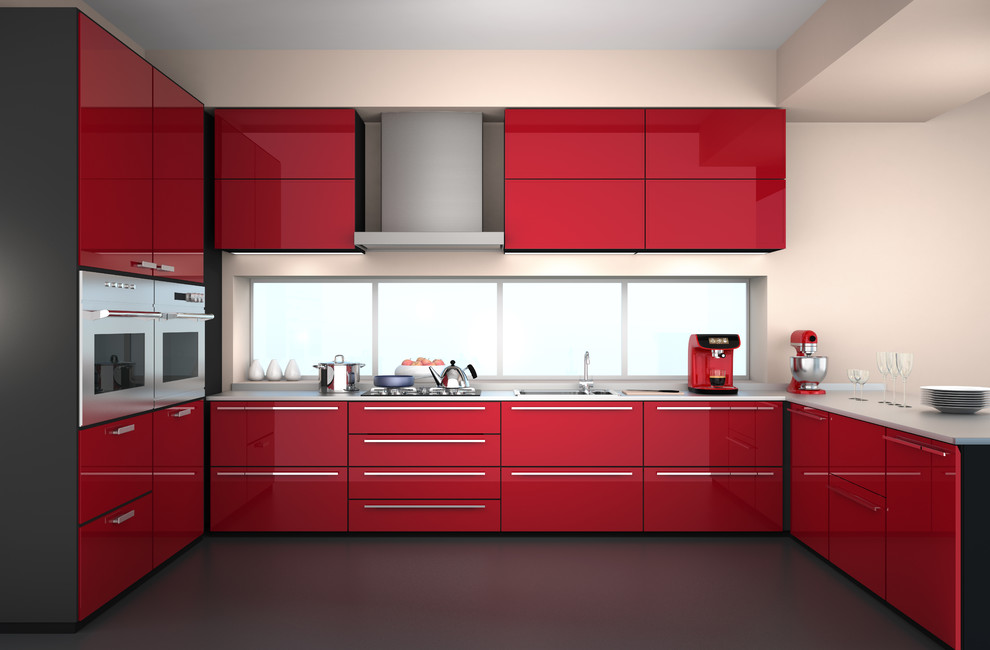 Mid-sized modern u-shaped kitchen pantry in Vancouver with flat-panel cabinets, red cabinets, solid surface benchtops, stainless steel appliances and with island.