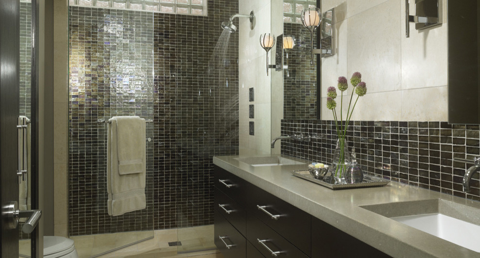 Photo of a contemporary bathroom in Miami with flat-panel cabinets, dark wood cabinets, a curbless shower and a one-piece toilet.