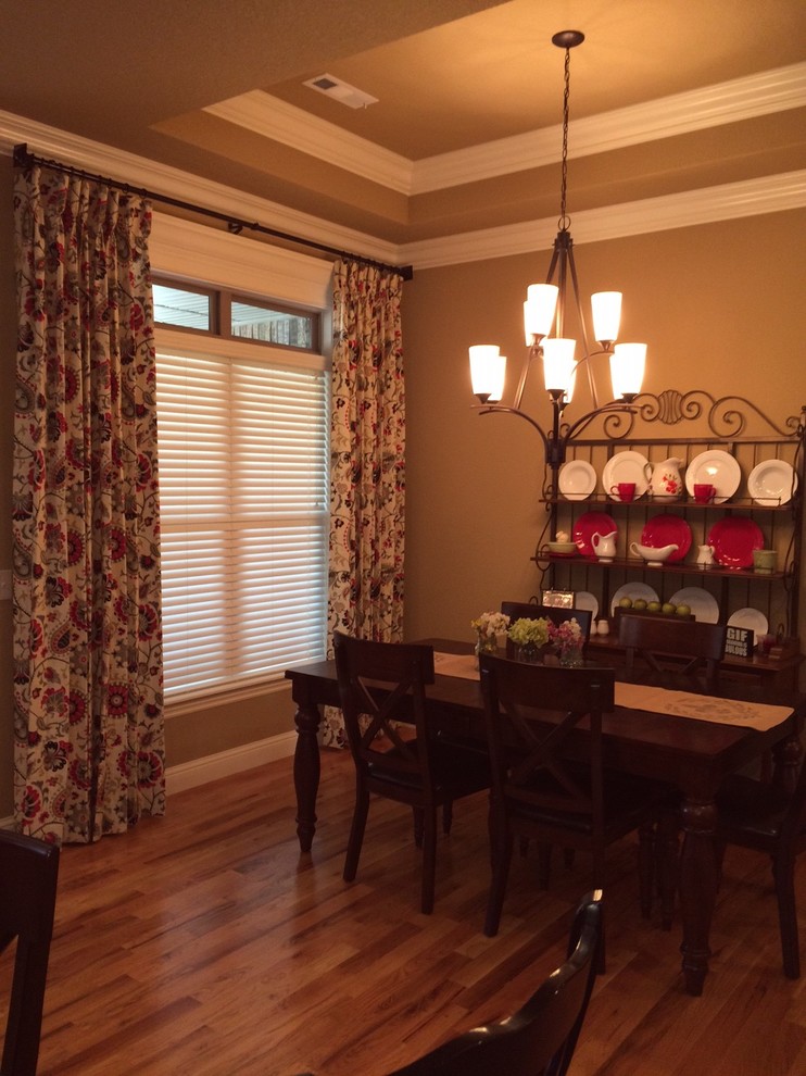 Inspiration for a small transitional light wood floor kitchen/dining room combo remodel with brown walls