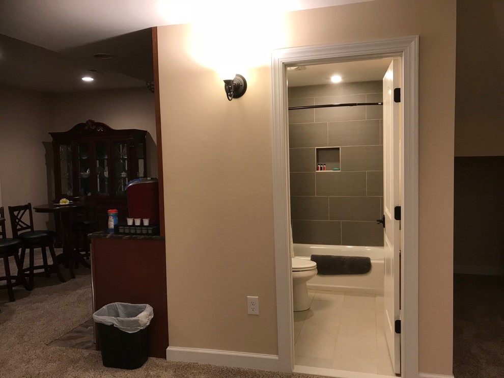 Finished Basement Bathroom with ceramic tile floor and tub